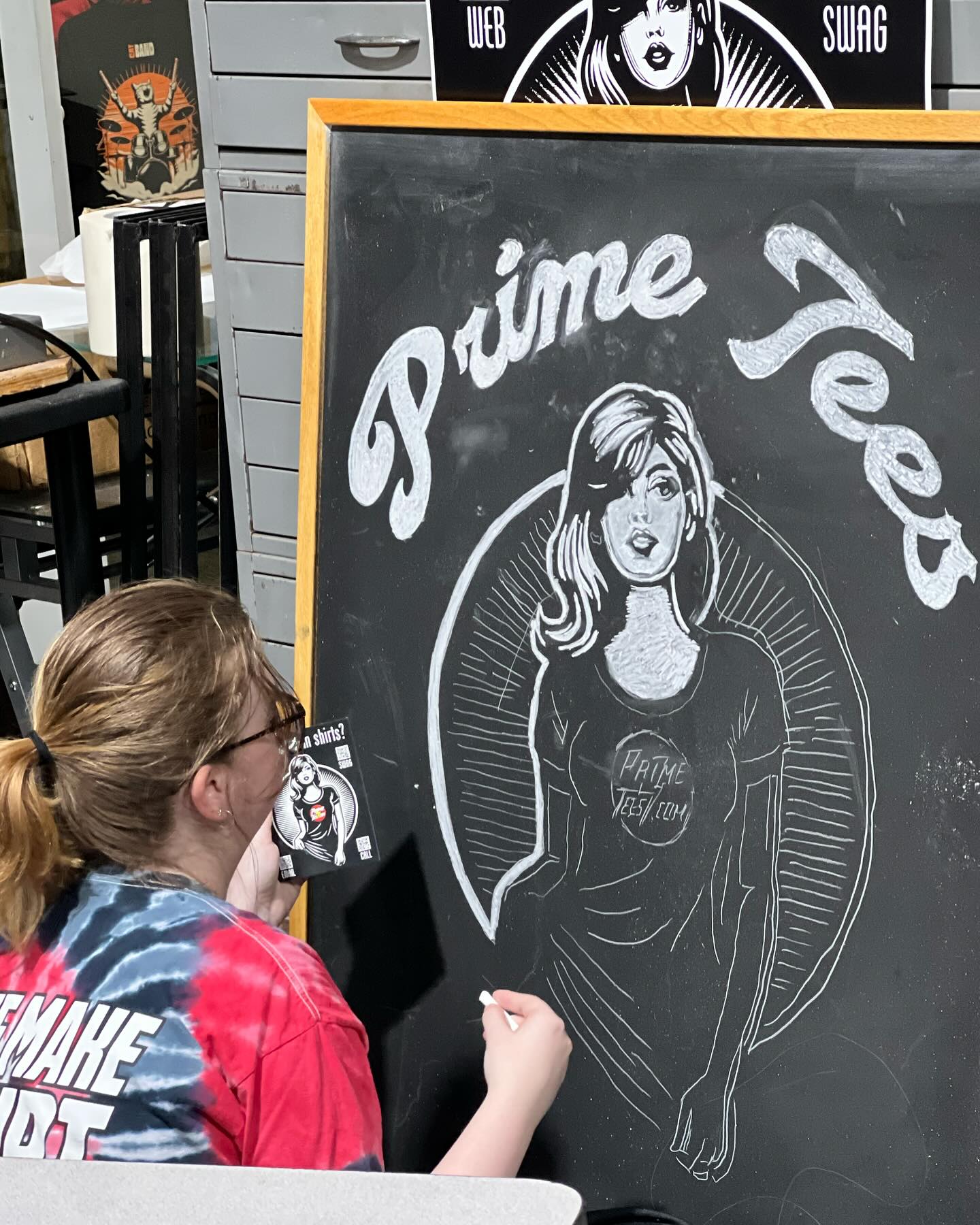 Introducing Ashley! She just graduated from UNT with a bachelor of art degree, she has been here part-time through the last semester of her college career. I had no choice but to hire her on the spot when she came in because of her joyous and infectious positivity. She is seen here helping out with transferring our new advertising campaign via chalkboard art for display in our lobby. You rock, Ashley!!!